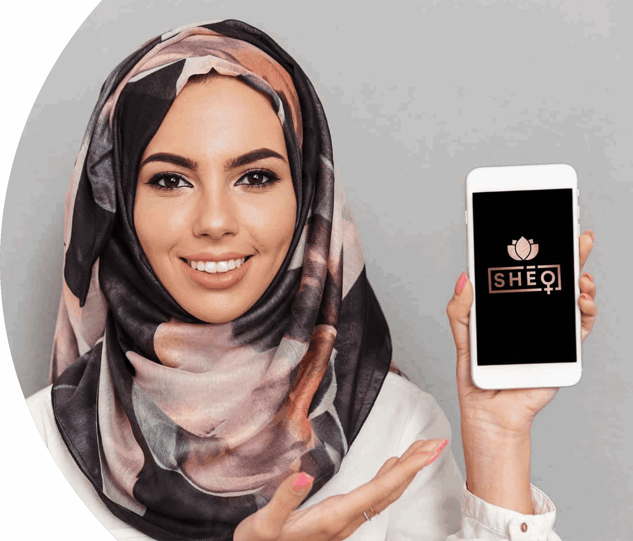 A woman wearing a patterned headscarf holding a phone with the SHEQONOMI app open
