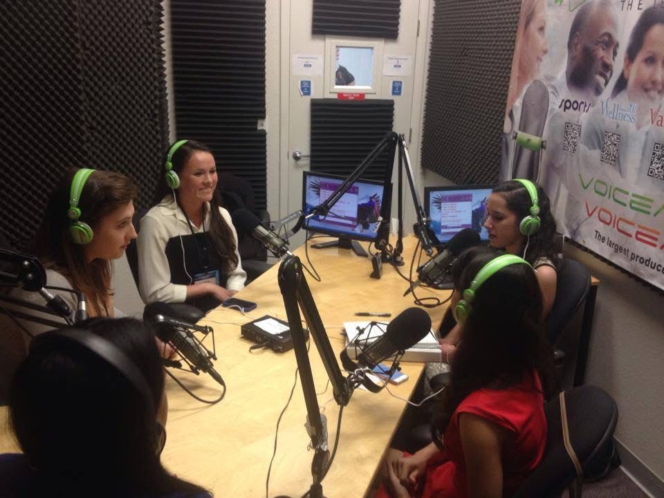 Women Investing in Women & Girls Radio Show LIVE from CGI-U — VoiceAmerica Kids studio, Scottsdale, Arizona, March 2014. Anu Bhardwaj (right, green headphones) with co-hosts and guests at the broadcast table.