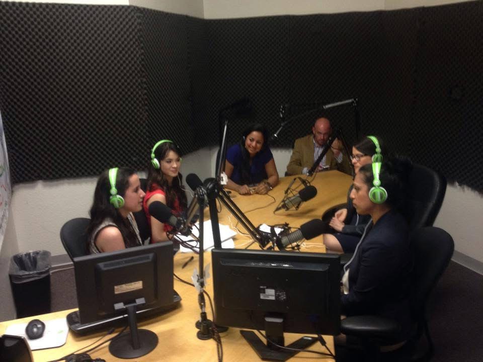 Full studio session — Women Investing in Women & Girls Radio Show, VoiceAmerica Kids, Clinton Global Initiative University, Arizona State University, Scottsdale, March 2014. Multiple guests and co-hosts around the broadcast table with green VoiceAmerica headphones.