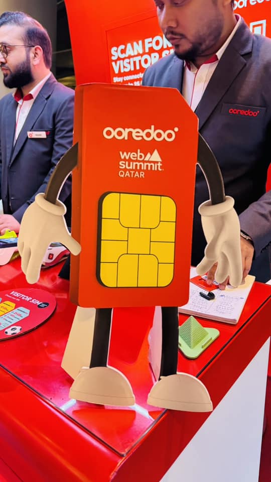 Ooredoo × Web Summit Qatar mascot at the Ooredoo booth