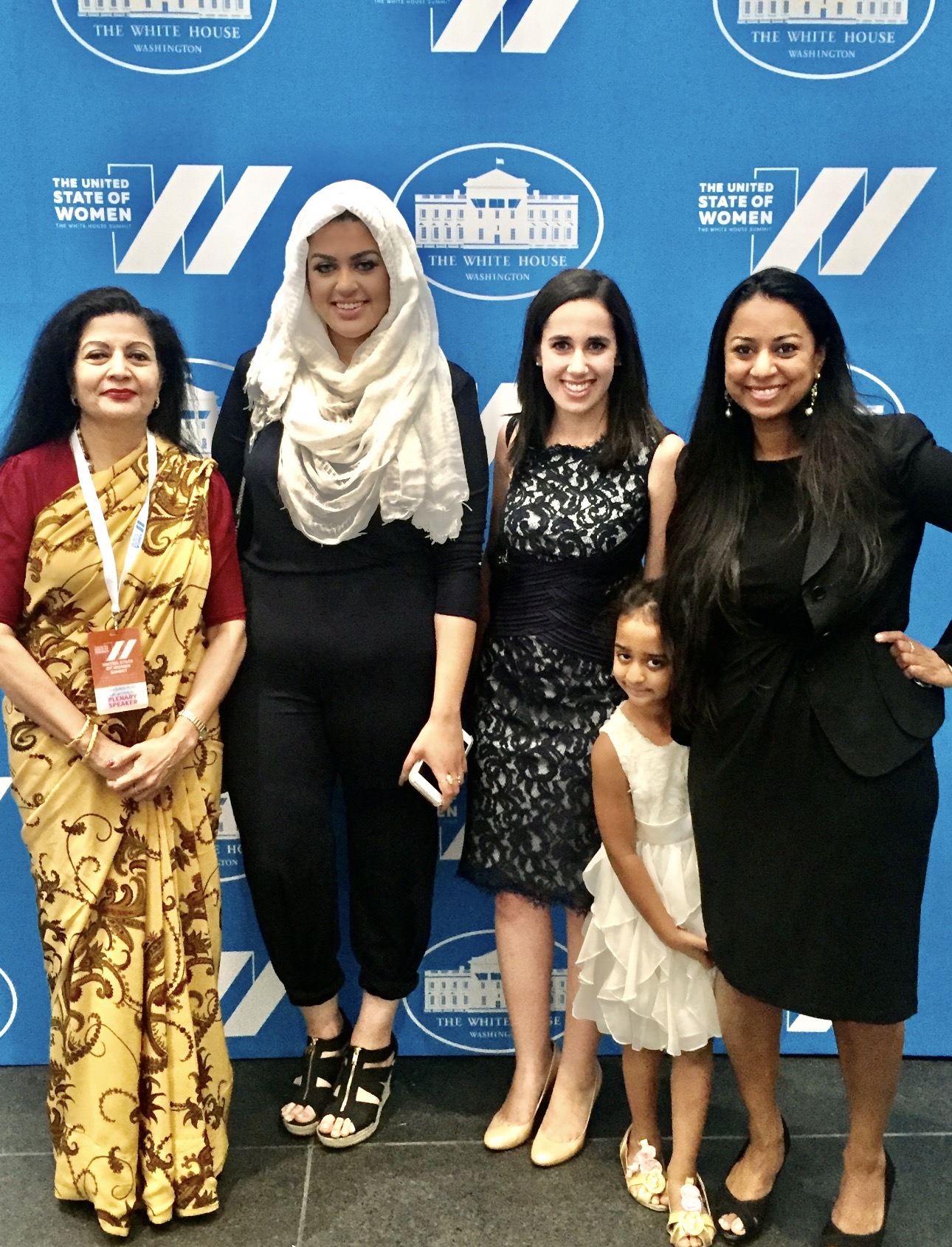 Group photo at the White House — The United State of Women Summit, Washington DC, June 14, 2016. Left to right: Lakshmi Puri (UN Women Deputy Executive Director & Assistant Secretary-General of the United Nations, Plenary Speaker); Amani Al-Khatahtbeh (Founder & Editor-in-Chief, MuslimGirl.com, Forbes 30 Under 30); Michelle Jaffee (Co-Host, Women Investing in Women & Girls); Arya Sitara Bhardwaj (Co-Host, Women Investing in Women & Girls, Nominated Changemaker, age 5); and a fellow changemaker.