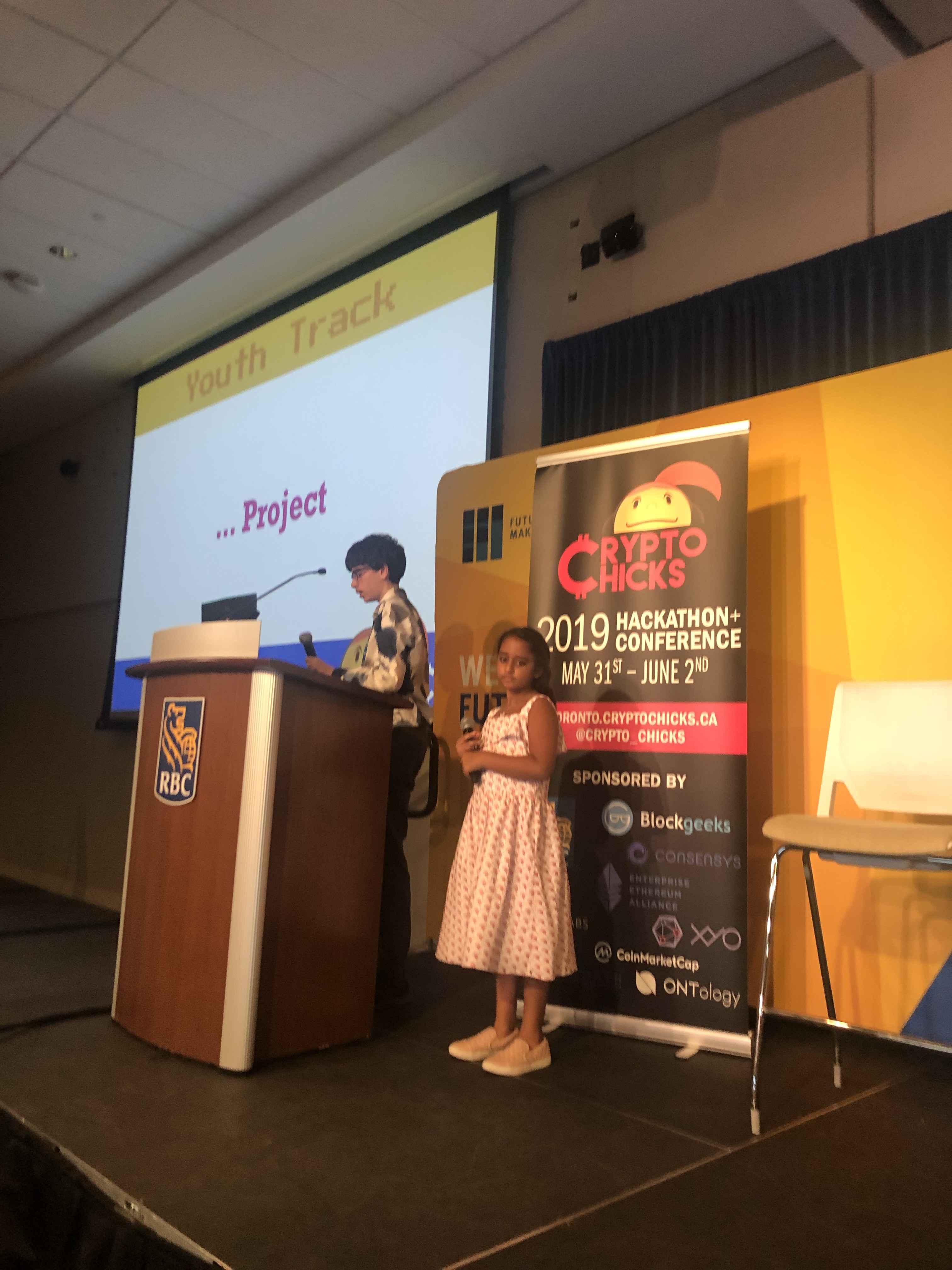 Arya Bhardwaj on stage at CryptoChicks 2019 Youth Track — presenting her blockchain project