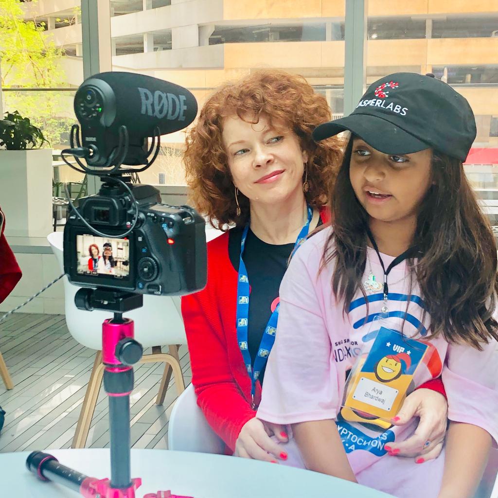 Arya Bhardwaj being interviewed at CryptoChicks Toronto 2019 — with RØDE mic setup