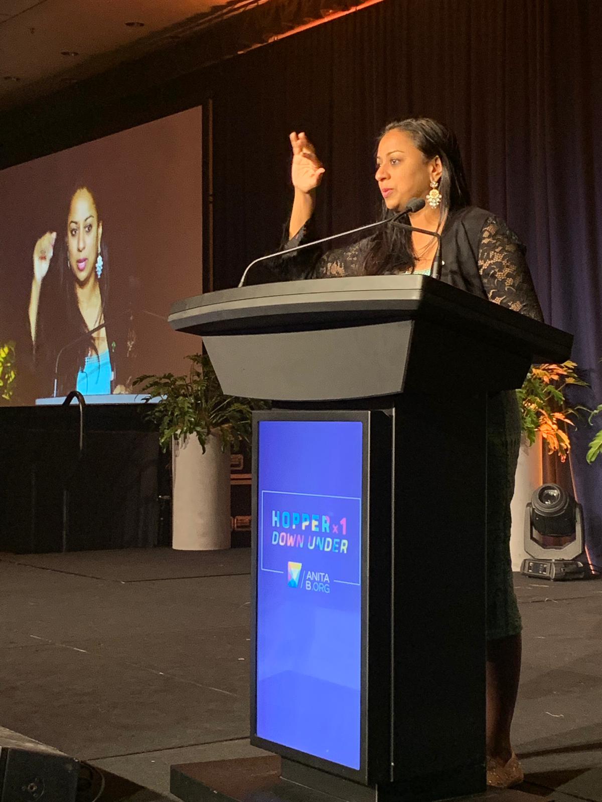 Anu Bhardwaj at the podium — Hopper x1 Down Under, AnitaB.org, Brisbane, July 2019