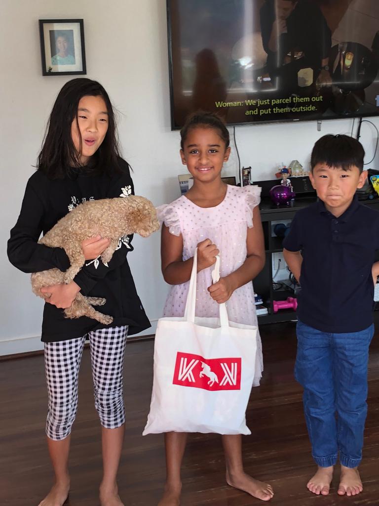 Arya Bhardwaj with Krypto for Kids tote bag and friends — Blockchain on the Beach, Laguna Beach 2018